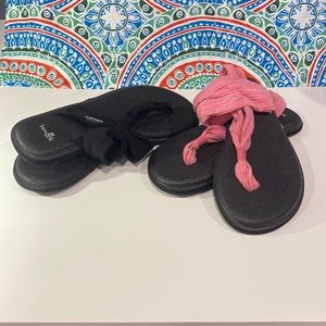 2 pair of Sanuk straps sandals. Woman’s size 7.  One black and one pink.